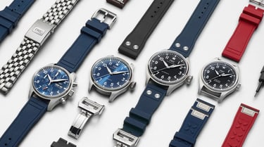 Group of IWC watches with blue, black and red color straps on white background